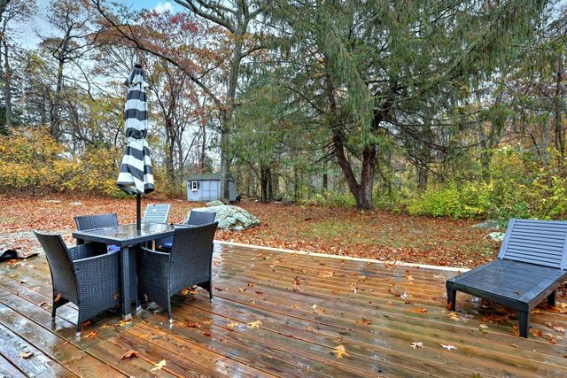a view of a backyard with sitting area
