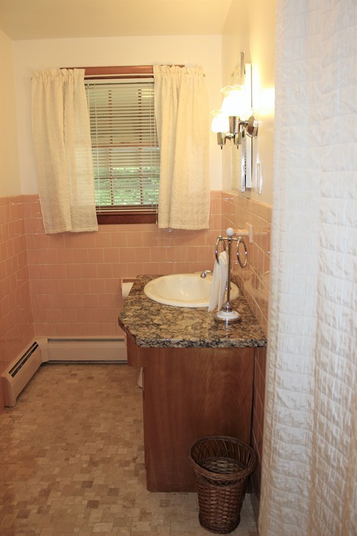 2 Ridge Road Hudson, MA 01749 - Photo 11 of 25 a bathroom with a granite countertop sink a toilet and a mirror