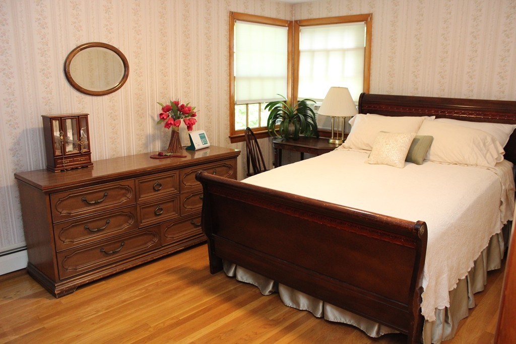 2 Ridge Road Hudson, MA 01749 - Photo 14 of 25 a bed room with a bed mirror and a window