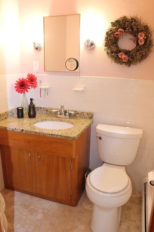2 Ridge Road Hudson, MA 01749 - Photo 16 of 25 a bathroom with a sink a toilet and mirror