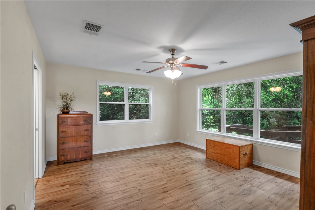9997 Calhoun Road Bryan, TX 77808 - Photo 23 of 50 a living room with furniture and a large window