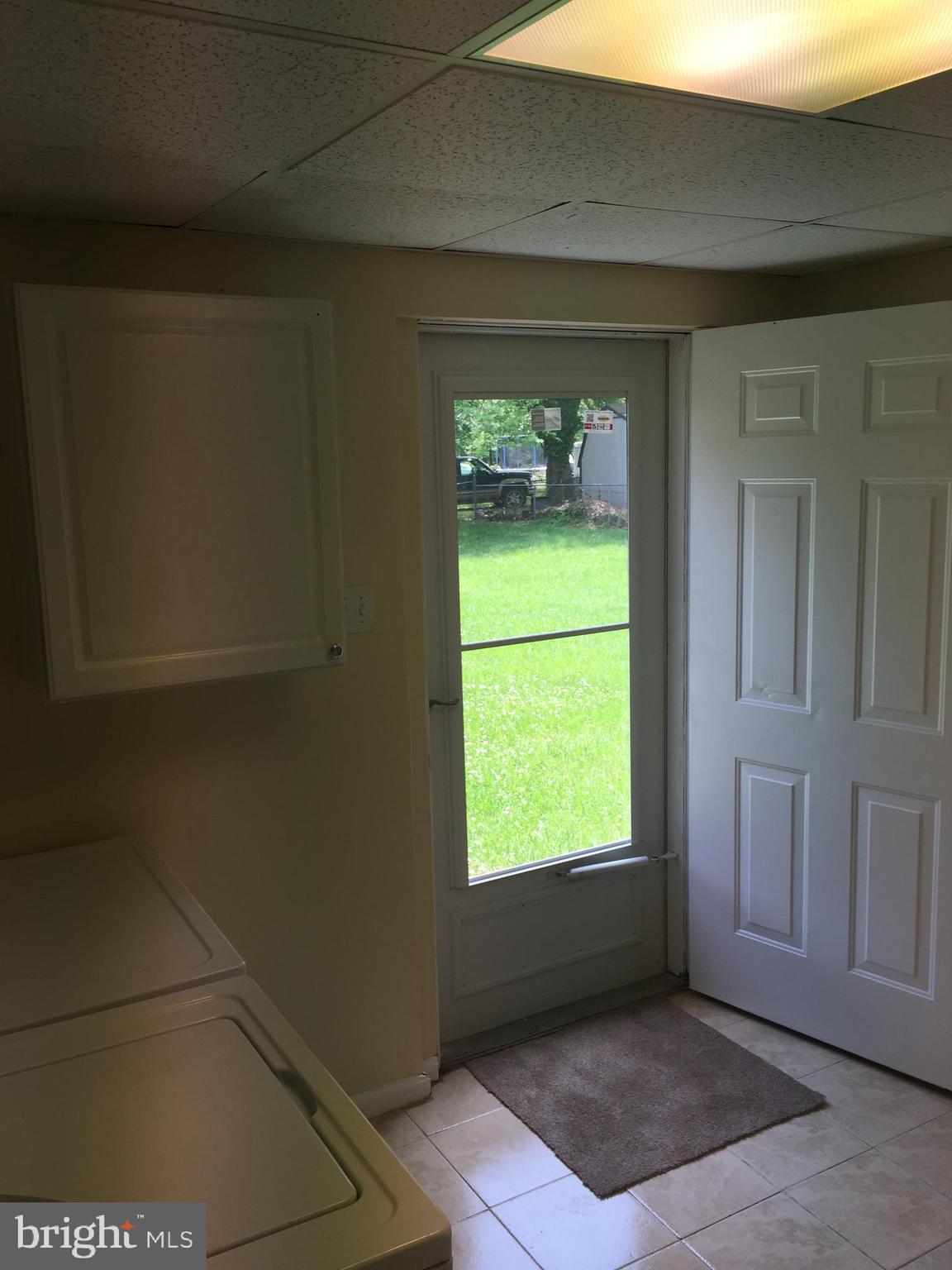8602 Fort Foote Road Fort Washington, MD 20744 - Photo 20 of 22 Laundry Room with walk out door to 1/3 acre lot