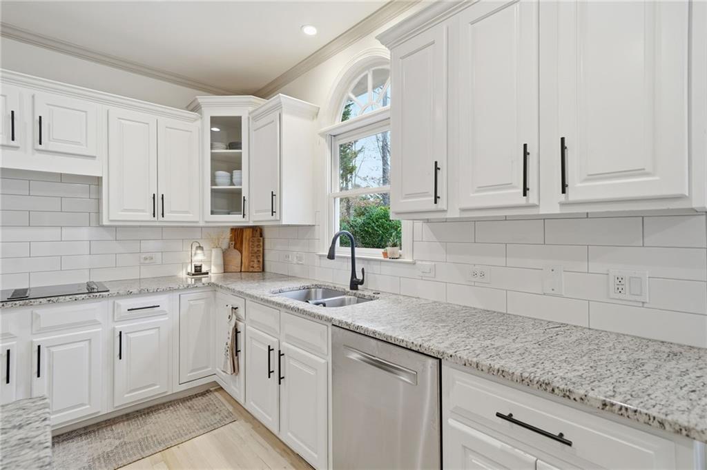 207 Cedarhurst Drive Canton, GA 30115 - Photo 17 of 83 a kitchen with white cabinets white appliances and sink