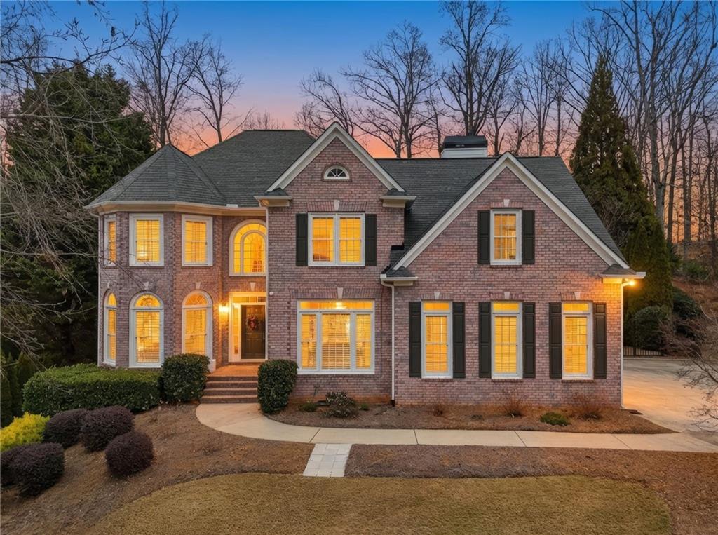 207 Cedarhurst Drive Canton, GA 30115 - Photo 2 of 83 a front view of a house with a yard