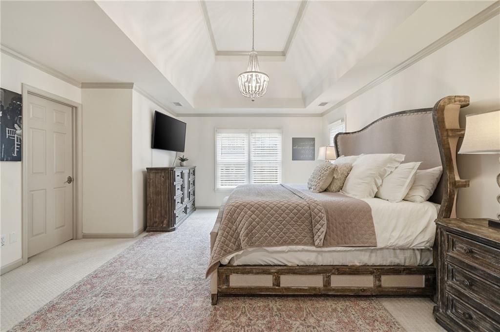 207 Cedarhurst Drive Canton, GA 30115 - Photo 28 of 83 a spacious bedroom with a bed and a television