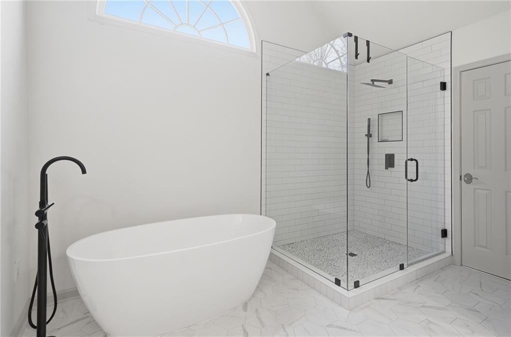 207 Cedarhurst Drive Canton, GA 30115 - Photo 33 of 83 a white bath tub sitting next to a shower