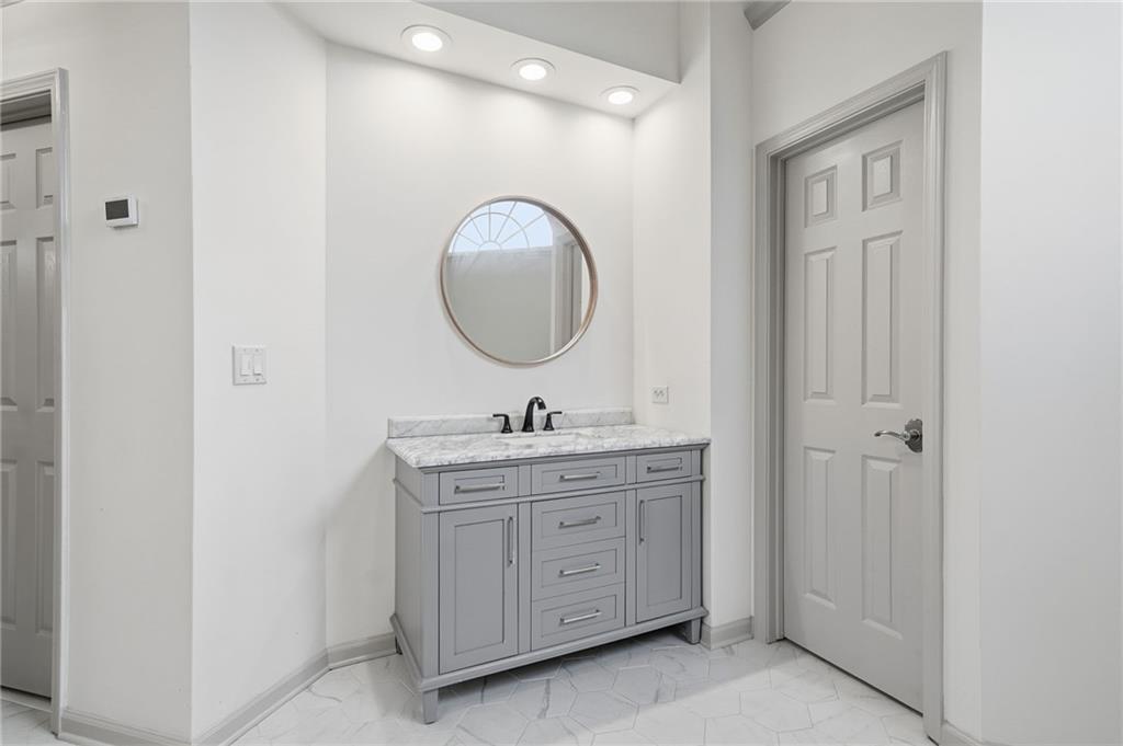 207 Cedarhurst Drive Canton, GA 30115 - Photo 34 of 83 a bathroom with a granite countertop sink a mirror and a vanity
