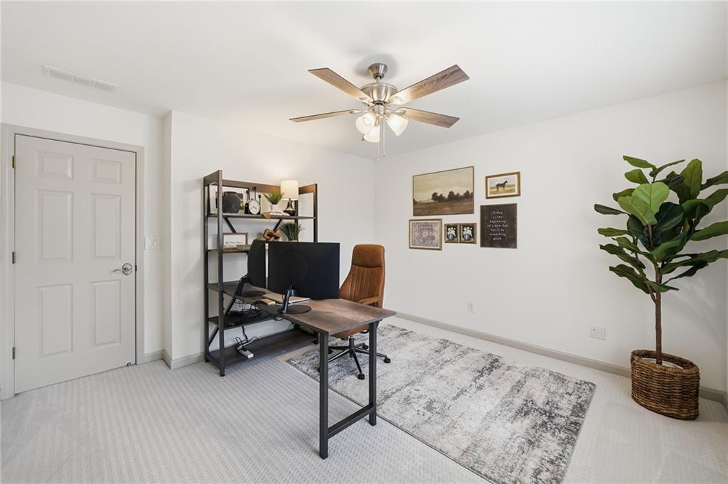 207 Cedarhurst Drive Canton, GA 30115 - Photo 41 of 83 a workspace with furniture and a potted plant