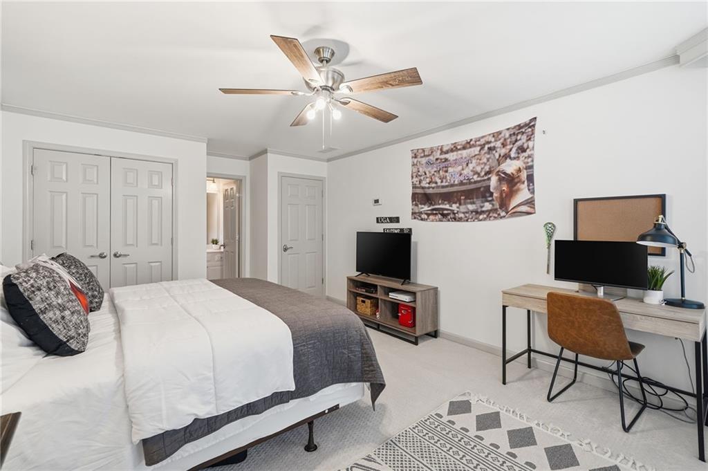 207 Cedarhurst Drive Canton, GA 30115 - Photo 43 of 83 a bedroom with a bed and a flat screen tv