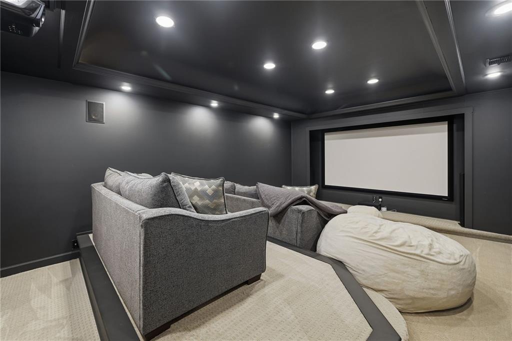 207 Cedarhurst Drive Canton, GA 30115 - Photo 50 of 83 a mini theater with a projector screen and couches