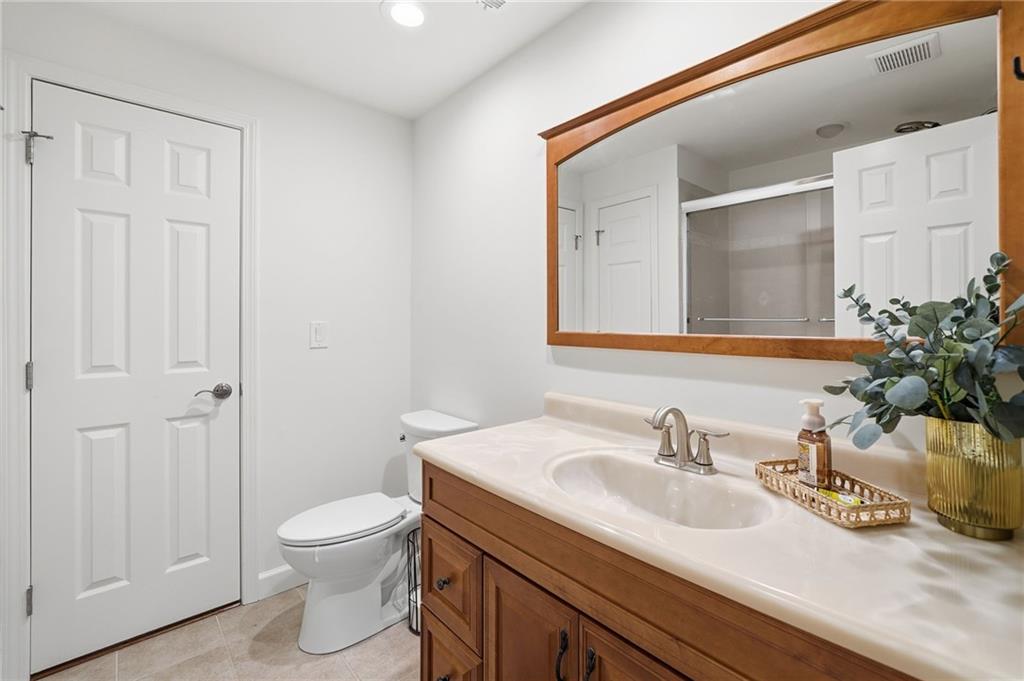 207 Cedarhurst Drive Canton, GA 30115 - Photo 56 of 83 a bathroom with a sink and a toilet