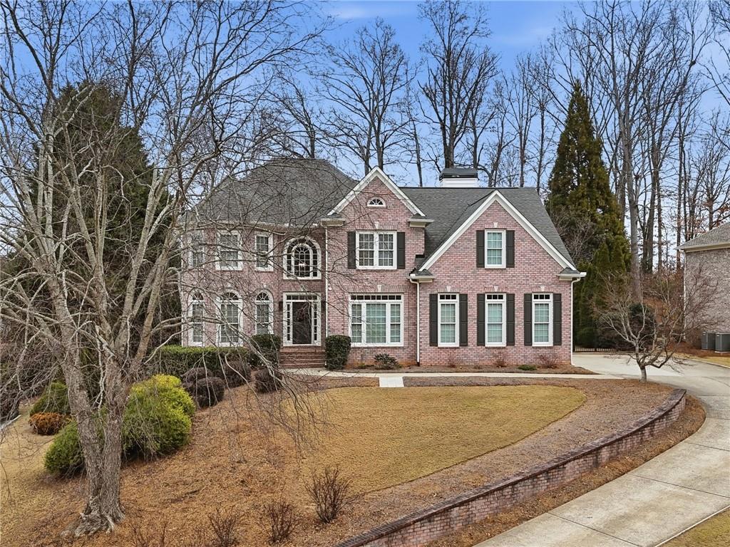 207 Cedarhurst Drive Canton, GA 30115 - Photo 68 of 83 a front view of a house with a yard