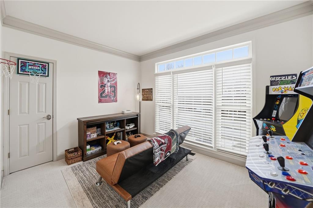 207 Cedarhurst Drive Canton, GA 30115 - Photo 8 of 83 a bedroom with furniture and a flat screen tv