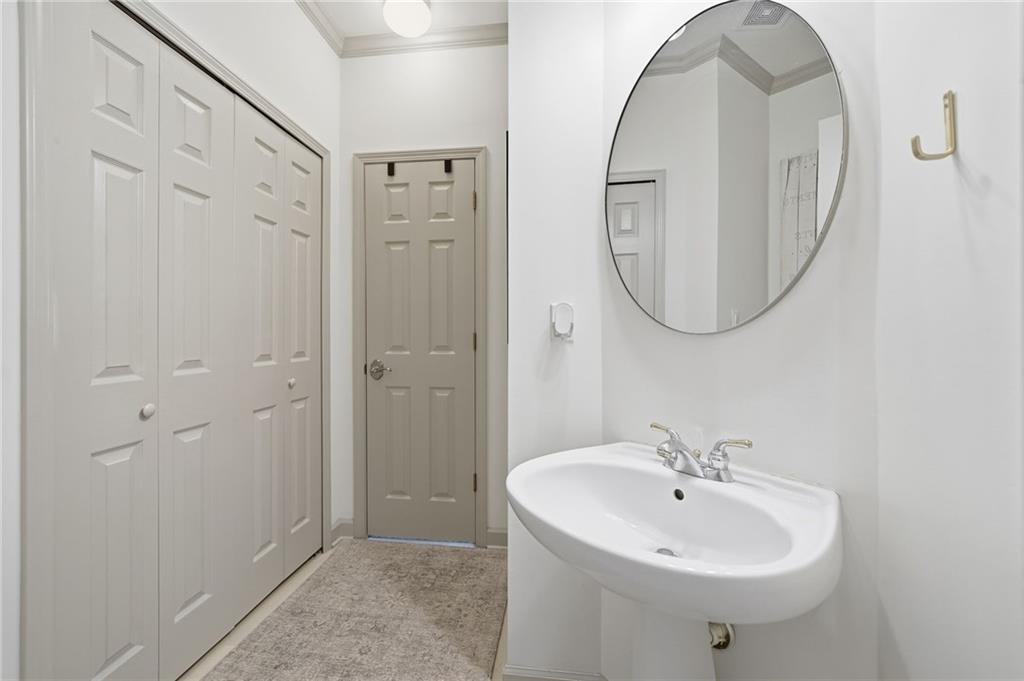 207 Cedarhurst Drive Canton, GA 30115 - Photo 9 of 83 a bathroom with a sink a mirror and a shower