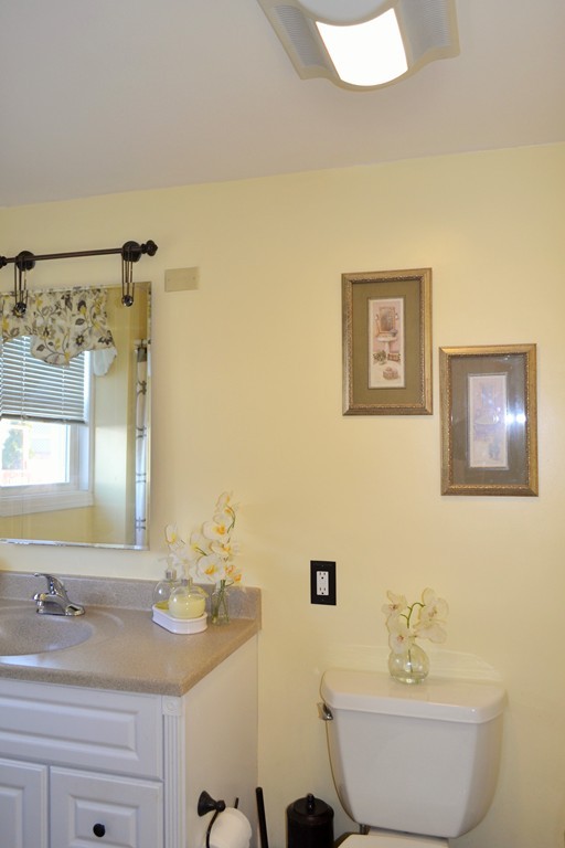 29 Station Road Salem, MA 01970 - Photo 11 of 24 a bathroom with a sink and a mirror