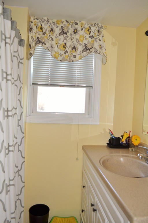 29 Station Road Salem, MA 01970 - Photo 12 of 24 a bathroom with a sink and a mirror
