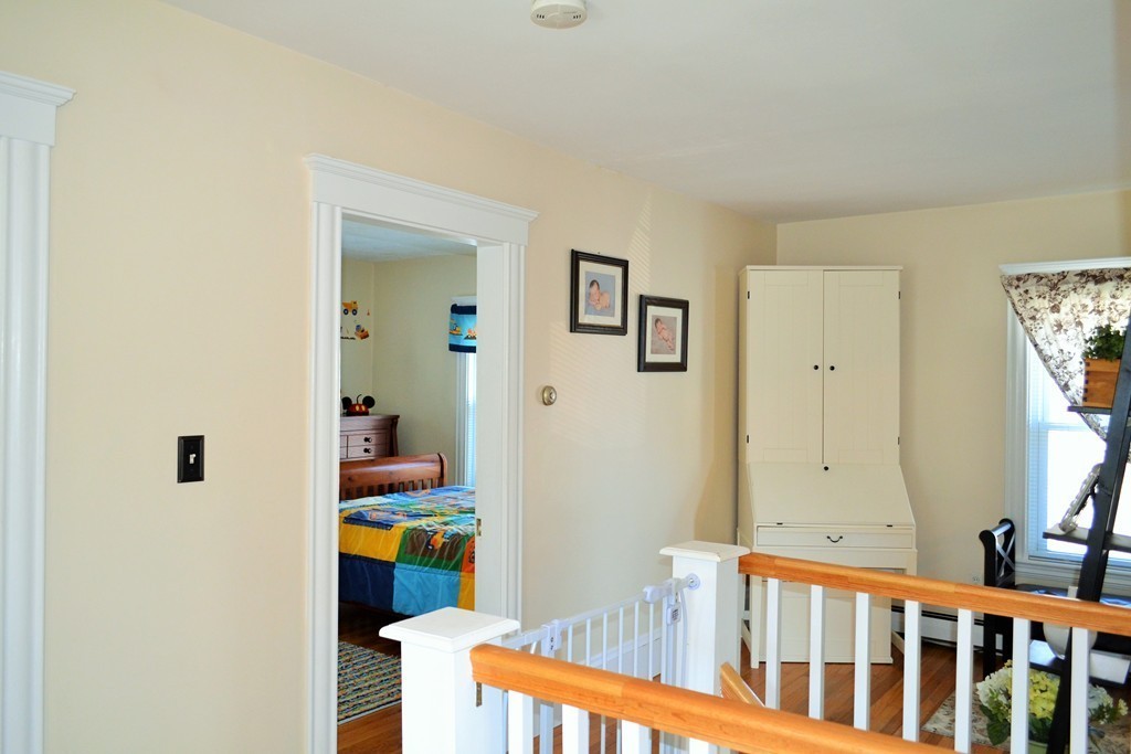 29 Station Road Salem, MA 01970 - Photo 18 of 24 a bedroom with a bed and a view of bathroom
