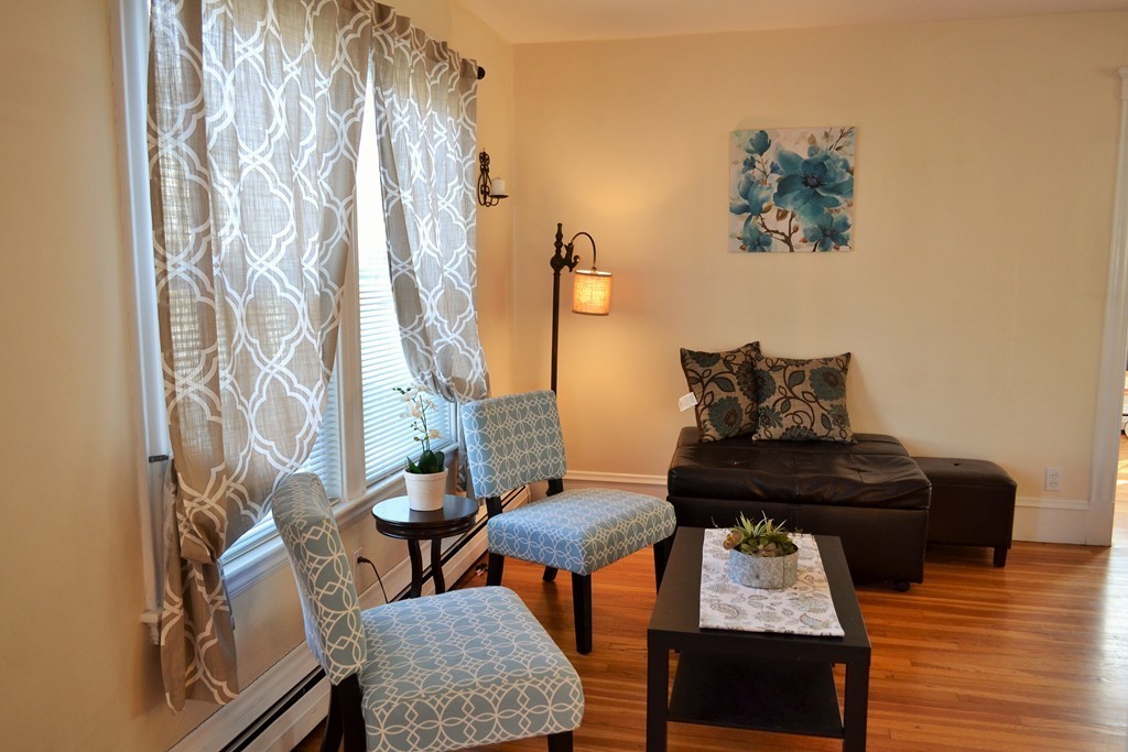29 Station Road Salem, MA 01970 - Photo 3 of 24 a living room with furniture and wooden floor