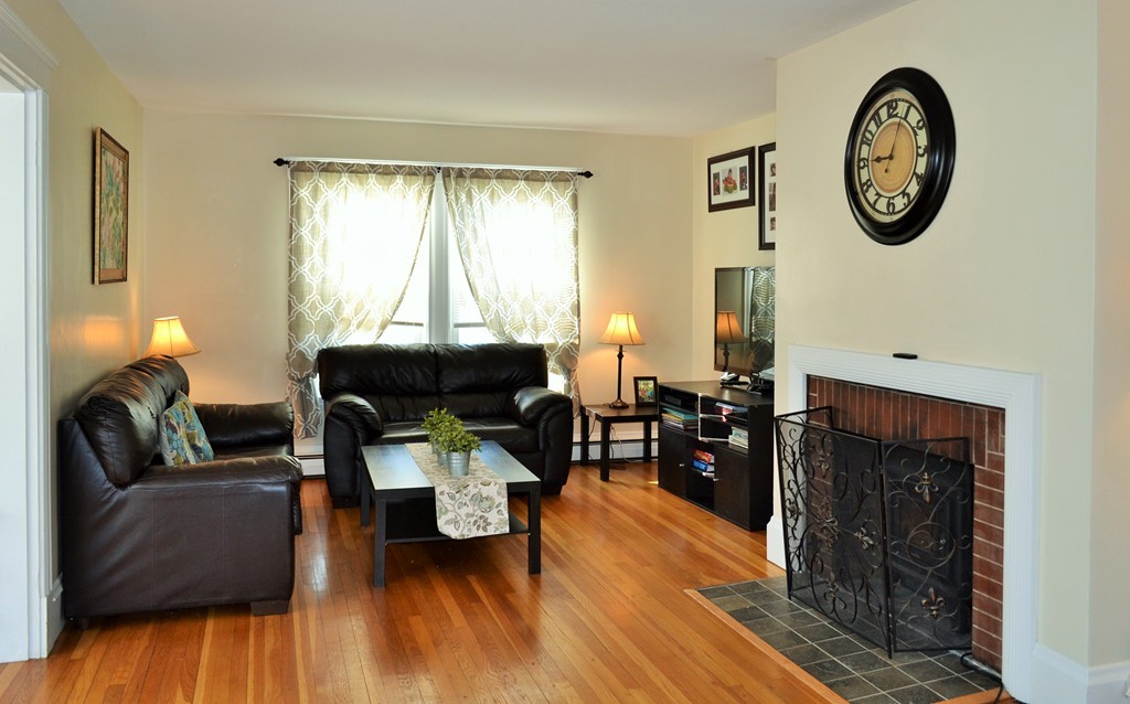 29 Station Road Salem, MA 01970 - Photo 5 of 24 a living room with furniture and a fireplace