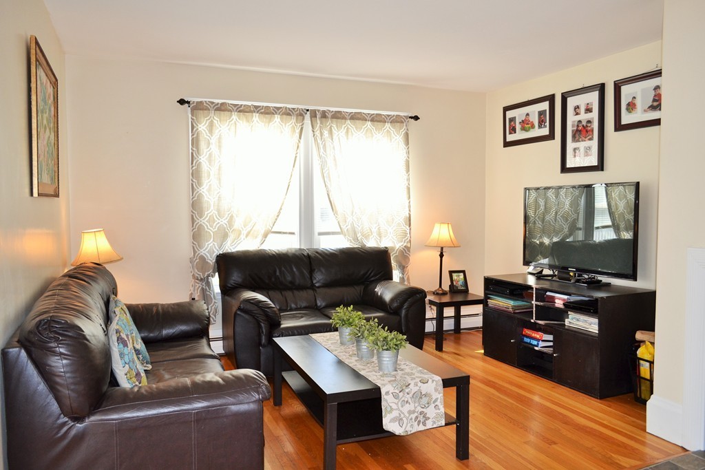29 Station Road Salem, MA 01970 - Photo 6 of 24 a living room with furniture and a flat screen tv