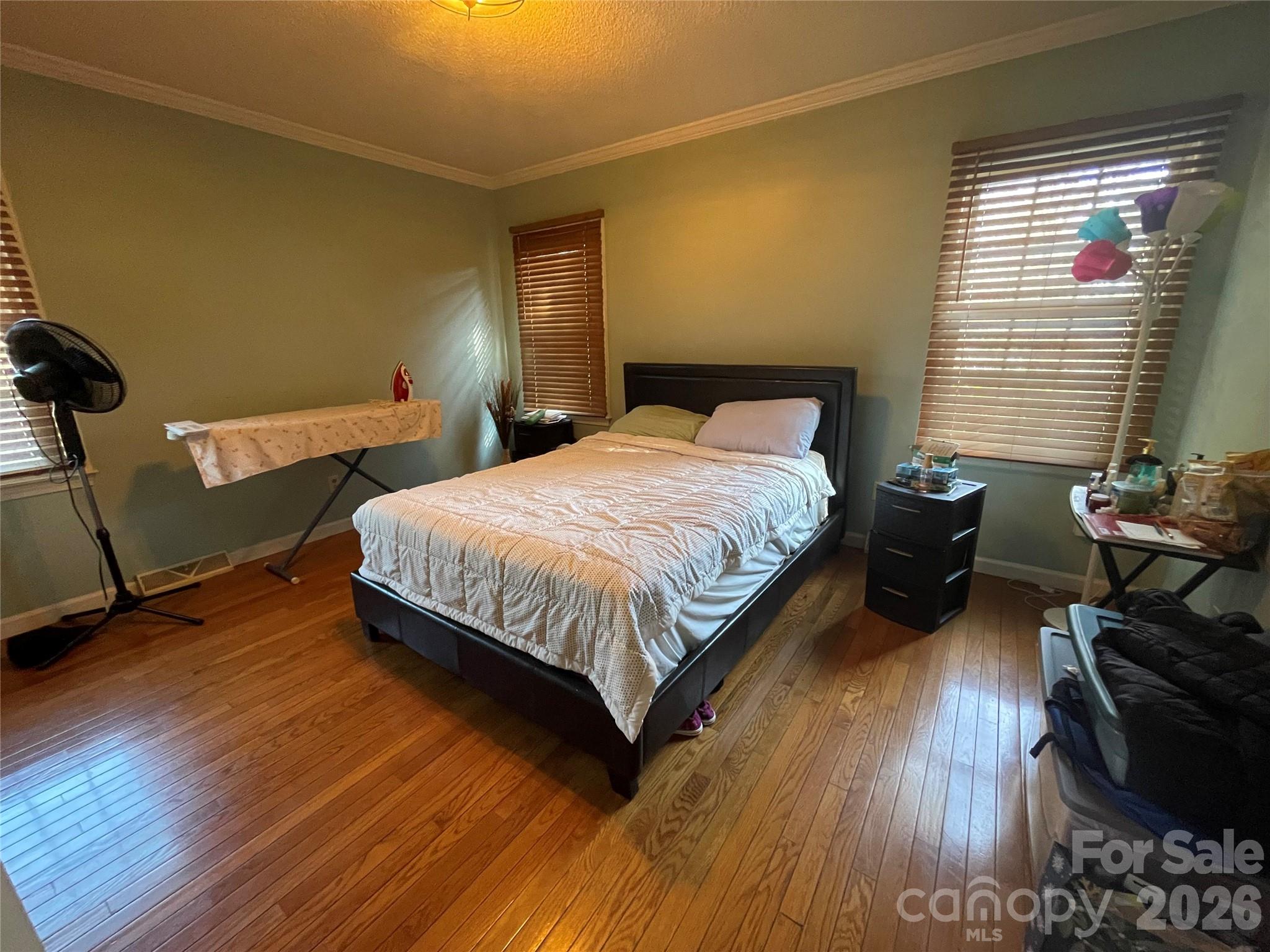 4907 Delmar Griffin Road Monroe, NC 28112 - Photo 11 of 25 a bedroom with a bed and wooden floor