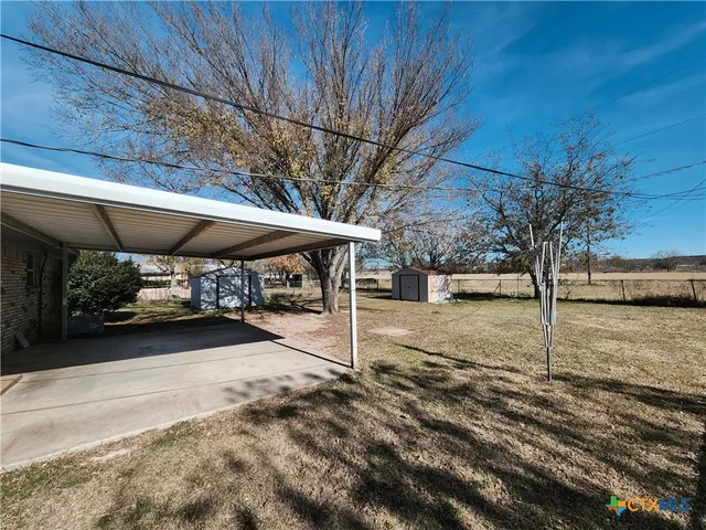 a view of a yard with a house