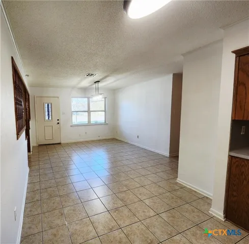 a view of empty room with windows