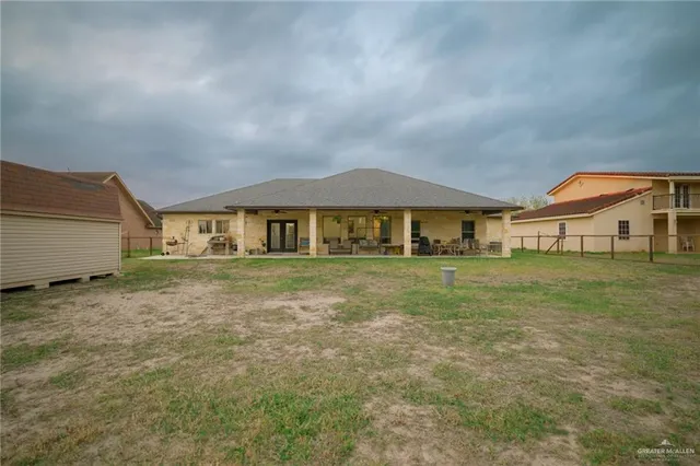 a view of a pathway with a wrought fence