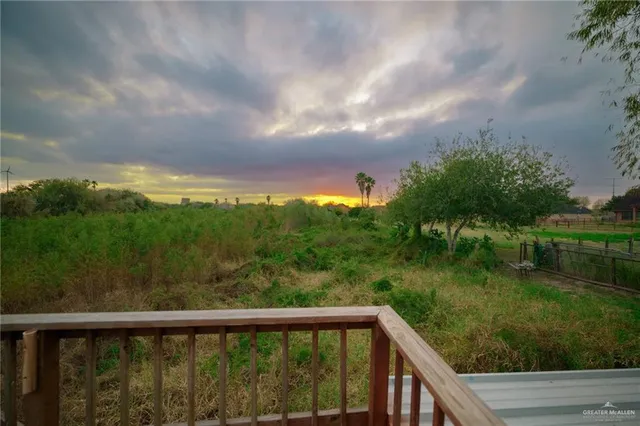 a view of a tiny house with a backyard
