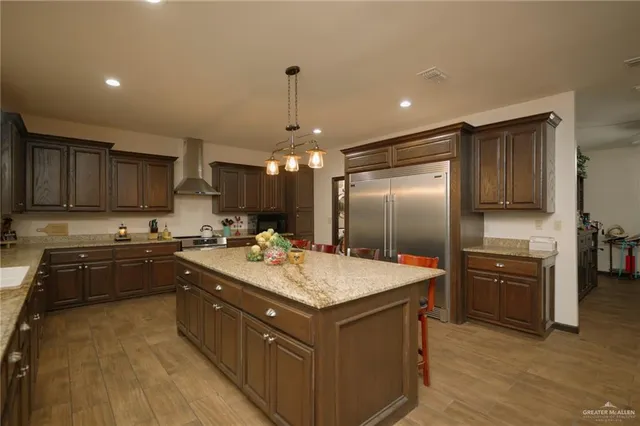 a kitchen with a sink stove and refrigerator