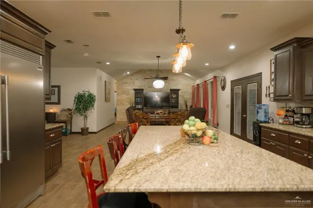 a large kitchen with kitchen island a large island in the center