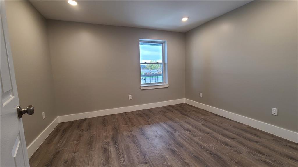 1331 Freeport Road Cheswick, PA 15024 - Photo 24 of 32 a view of empty room with wooden floor and fan