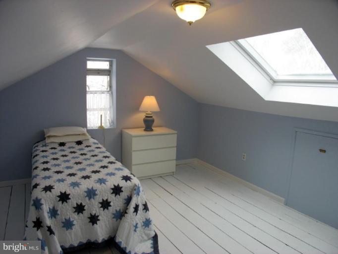 605 Deepdene Road Baltimore, MD 21210 - Photo 12 of 30 a bedroom with a bed and a window