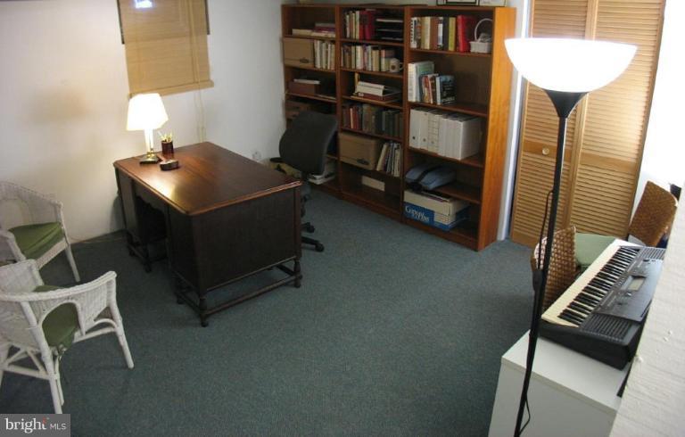 605 Deepdene Road Baltimore, MD 21210 - Photo 13 of 30 a room with furniture and a book shelf