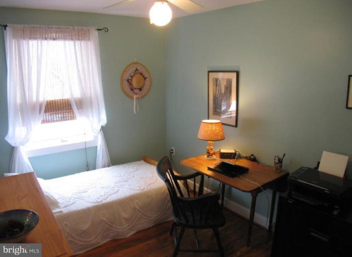 605 Deepdene Road Baltimore, MD 21210 - Photo 15 of 30 a bedroom with a bed and a window