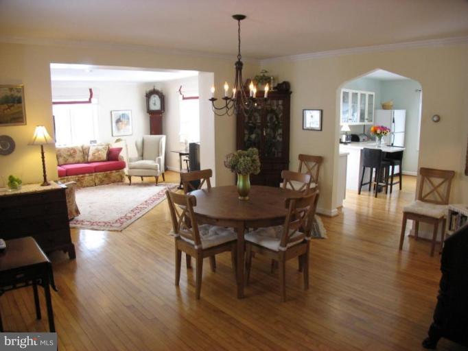 605 Deepdene Road Baltimore, MD 21210 - Photo 3 of 30 a view of a dining room with furniture and wooden floor