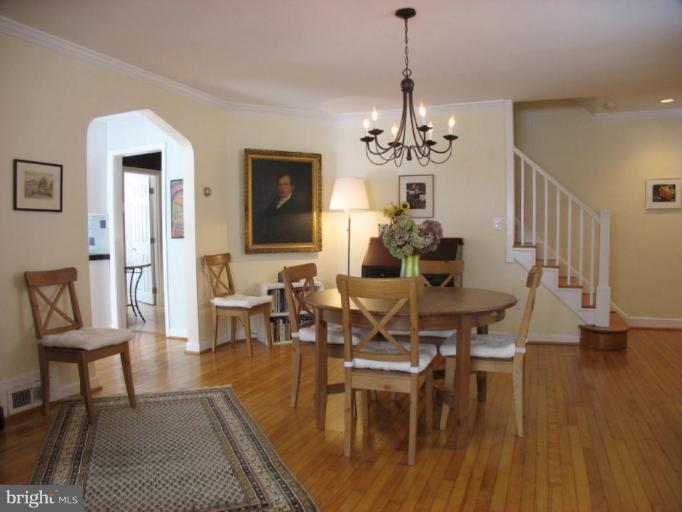 605 Deepdene Road Baltimore, MD 21210 - Photo 30 of 30 a living room with furniture dining table and a chandelier