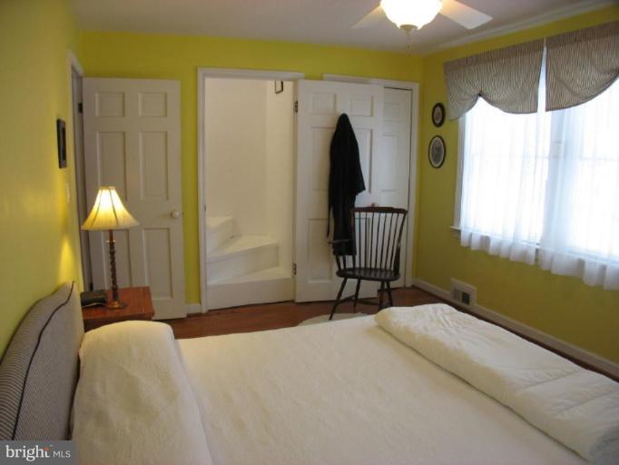 605 Deepdene Road Baltimore, MD 21210 - Photo 6 of 30 a bedroom with a bed and a table