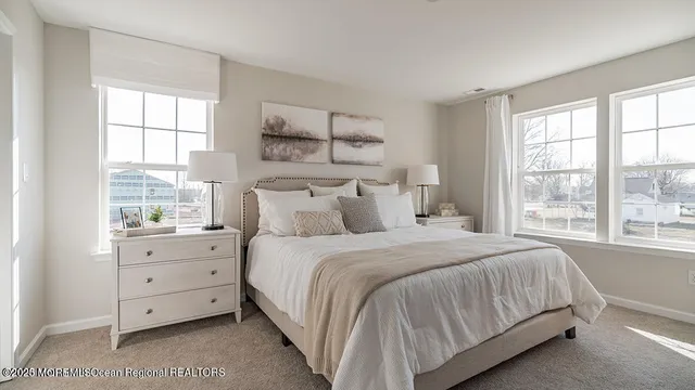 a bedroom with a bed and a night stand