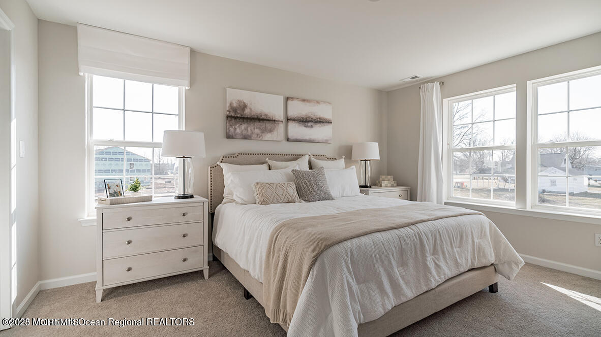 10 Mantoloking Drive Jackson, NJ 08527 - Photo 15 of 22 a bedroom with a bed and a window