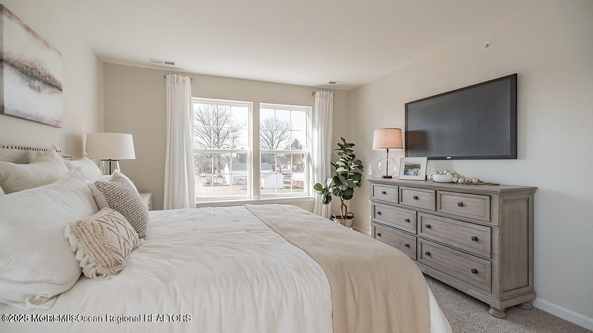 10 Mantoloking Drive Jackson, NJ 08527 - Photo 17 of 22 a bedroom with a bed and a flat screen tv