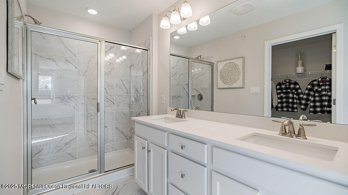 10 Mantoloking Drive Jackson, NJ 08527 - Photo 18 of 22 a bathroom with a sink and a mirror