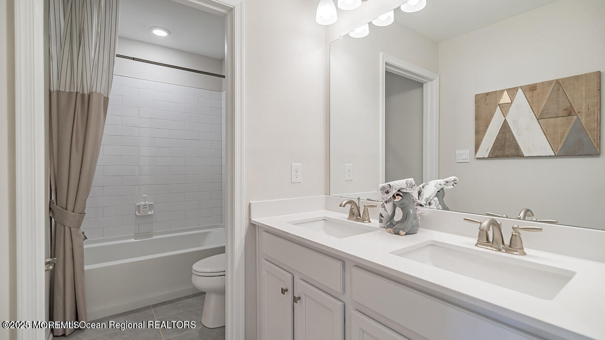 10 Mantoloking Drive Jackson, NJ 08527 - Photo 20 of 22 a bathroom with a sink a toilet and shower