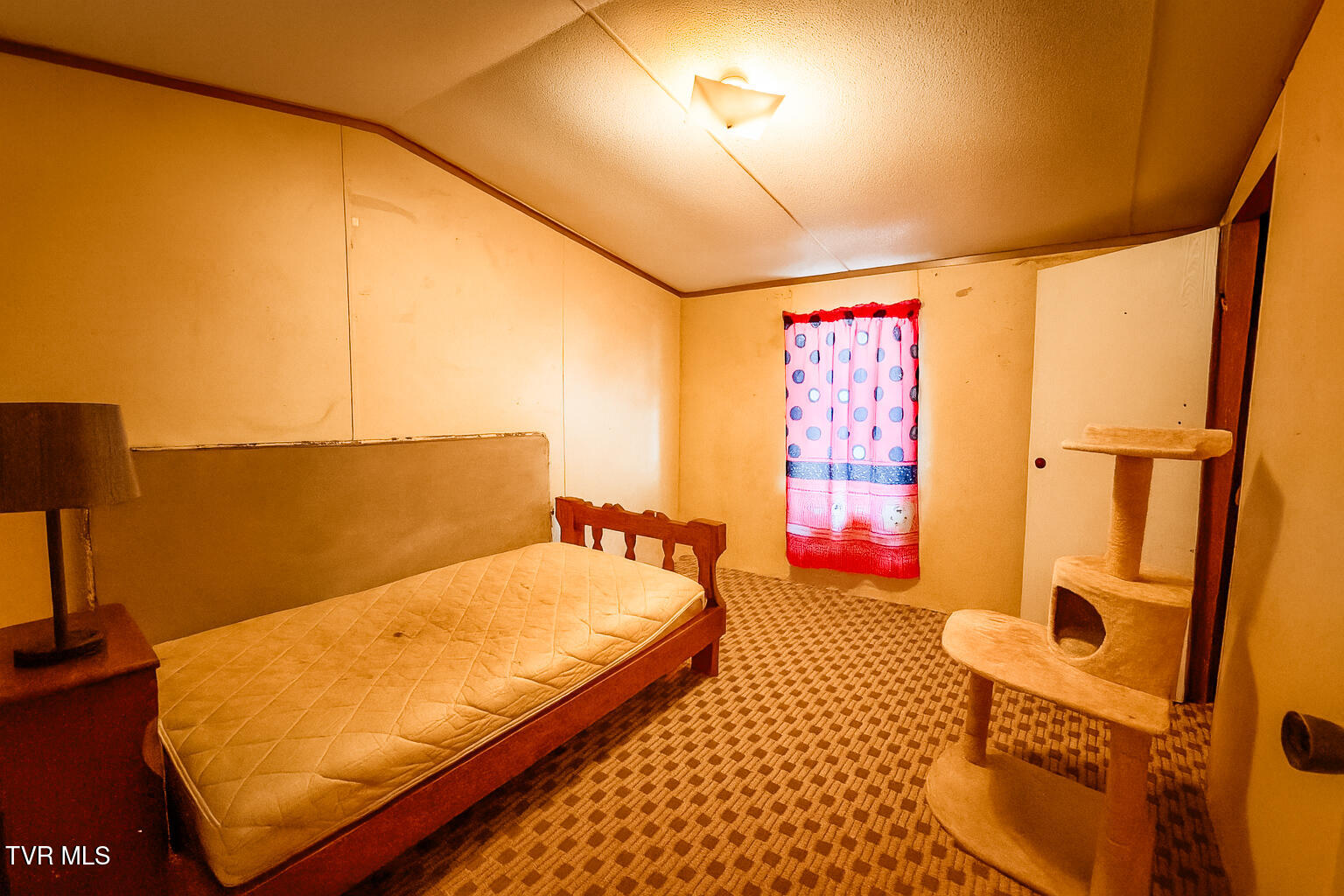 694 Heck Branch Road Rogersville, TN 37857 - Photo 12 of 13 Modest Bedroom with Pink Curtain