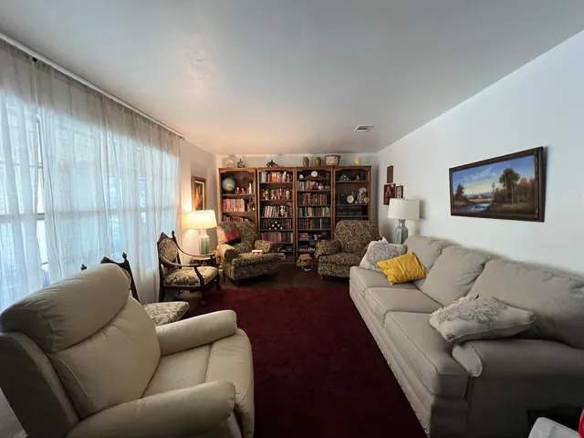 a living room with furniture and a couch