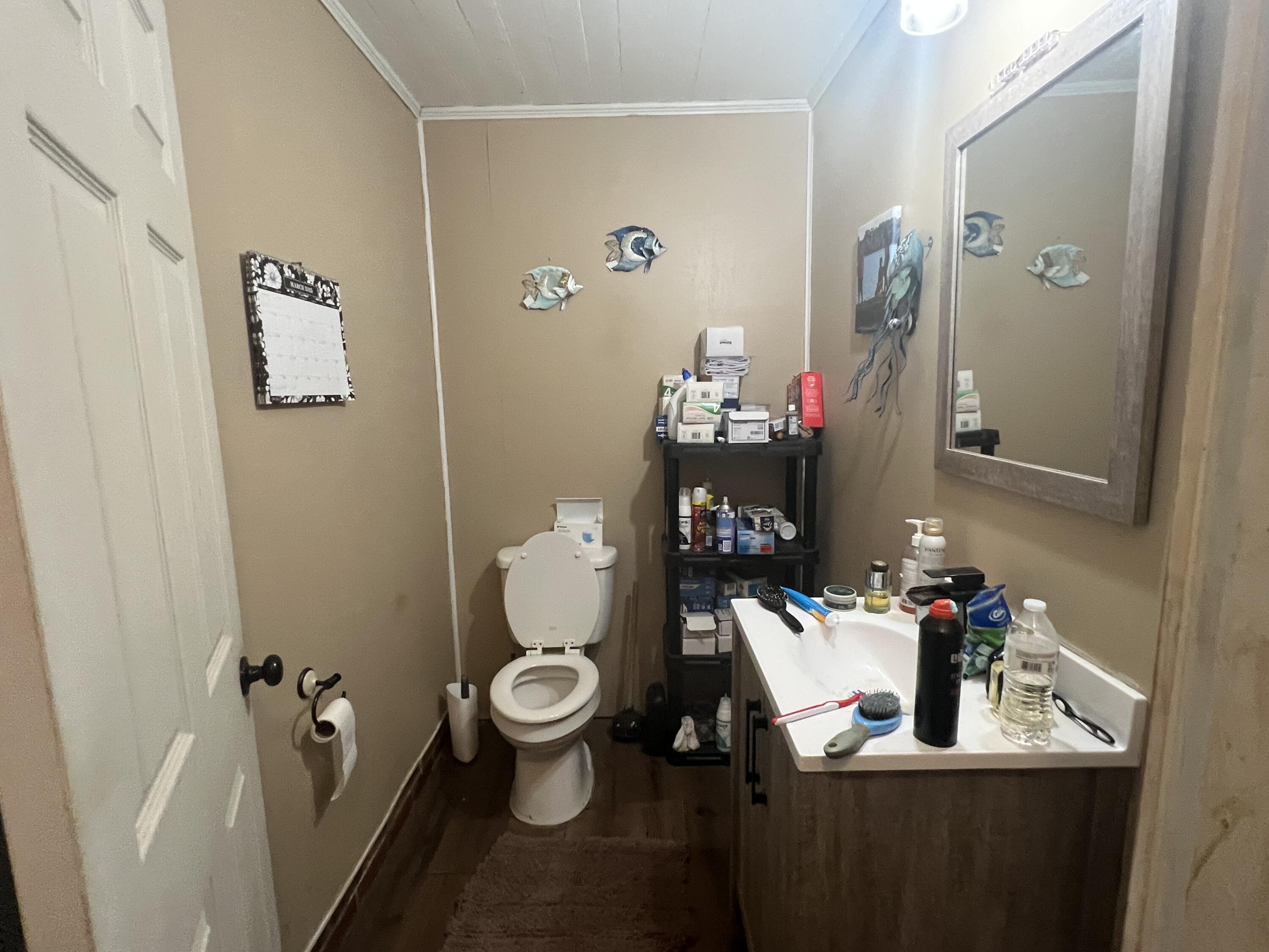 3211 Maple Street Crestview, FL 32539 - Photo 31 of 41 a bathroom with a sink toilet and shower