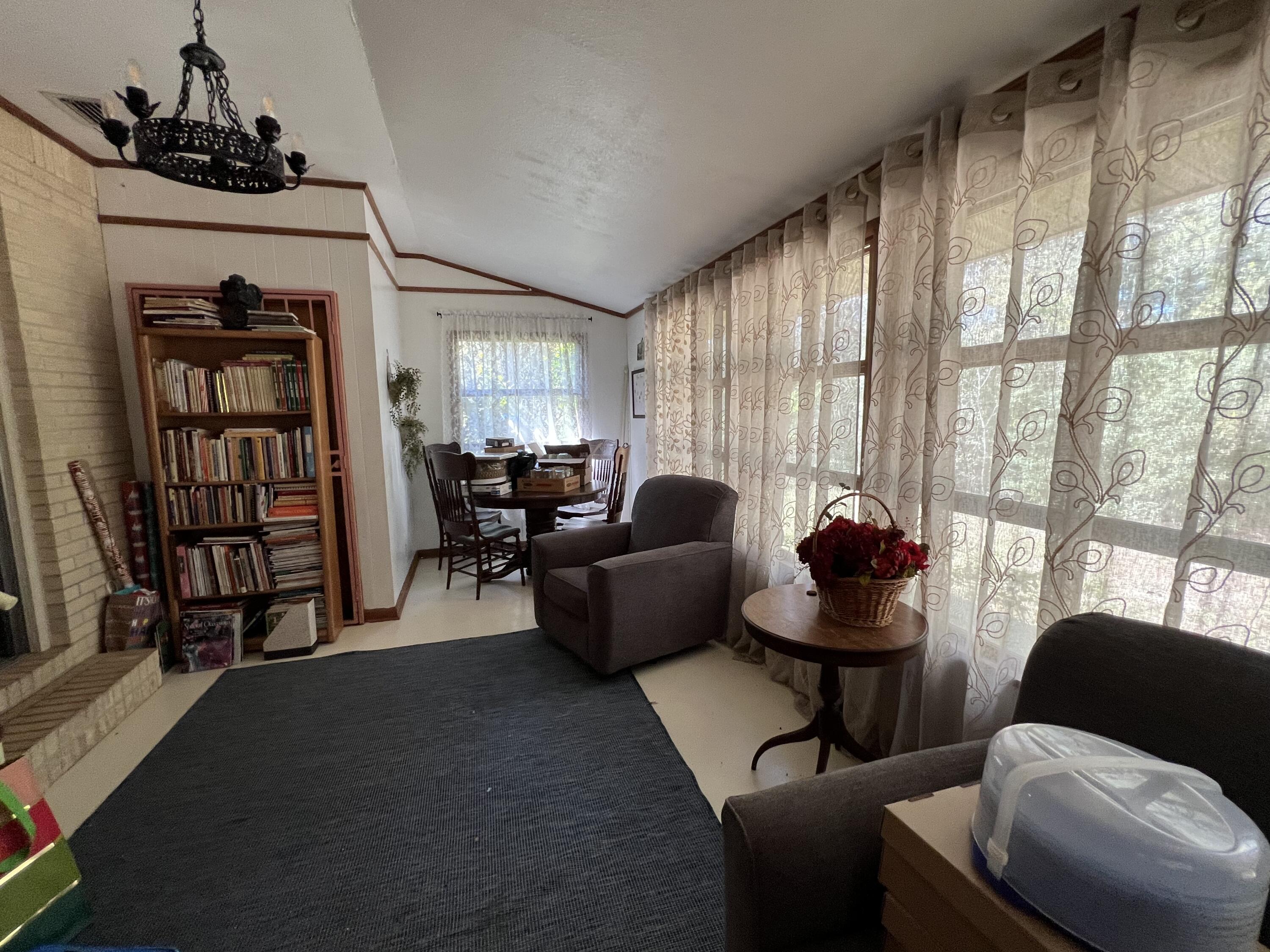 3211 Maple Street Crestview, FL 32539 - Photo 6 of 41 a living room with furniture and a window