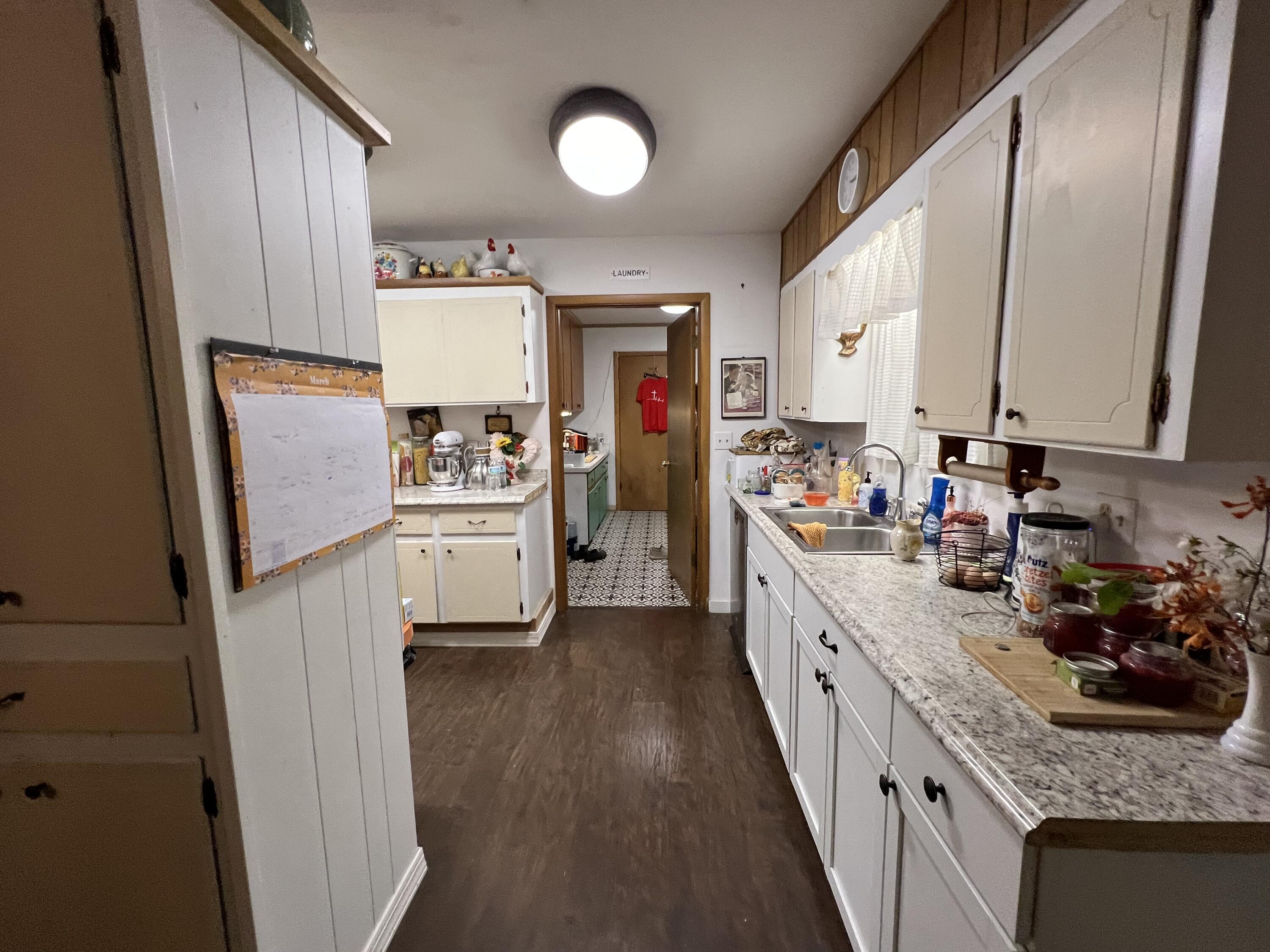 3211 Maple Street Crestview, FL 32539 - Photo 8 of 41 a kitchen with a sink stove and refrigerator