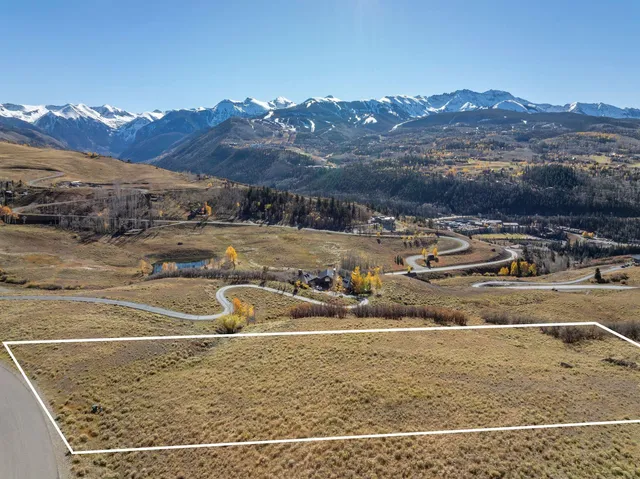 a view of a town with mountains
