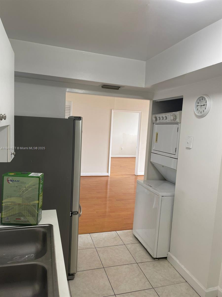8251 Northwest 8th Street, Unit 414 Miami, FL 33126 - Photo 24 of 25 view of living room with furniture and a refrigerator